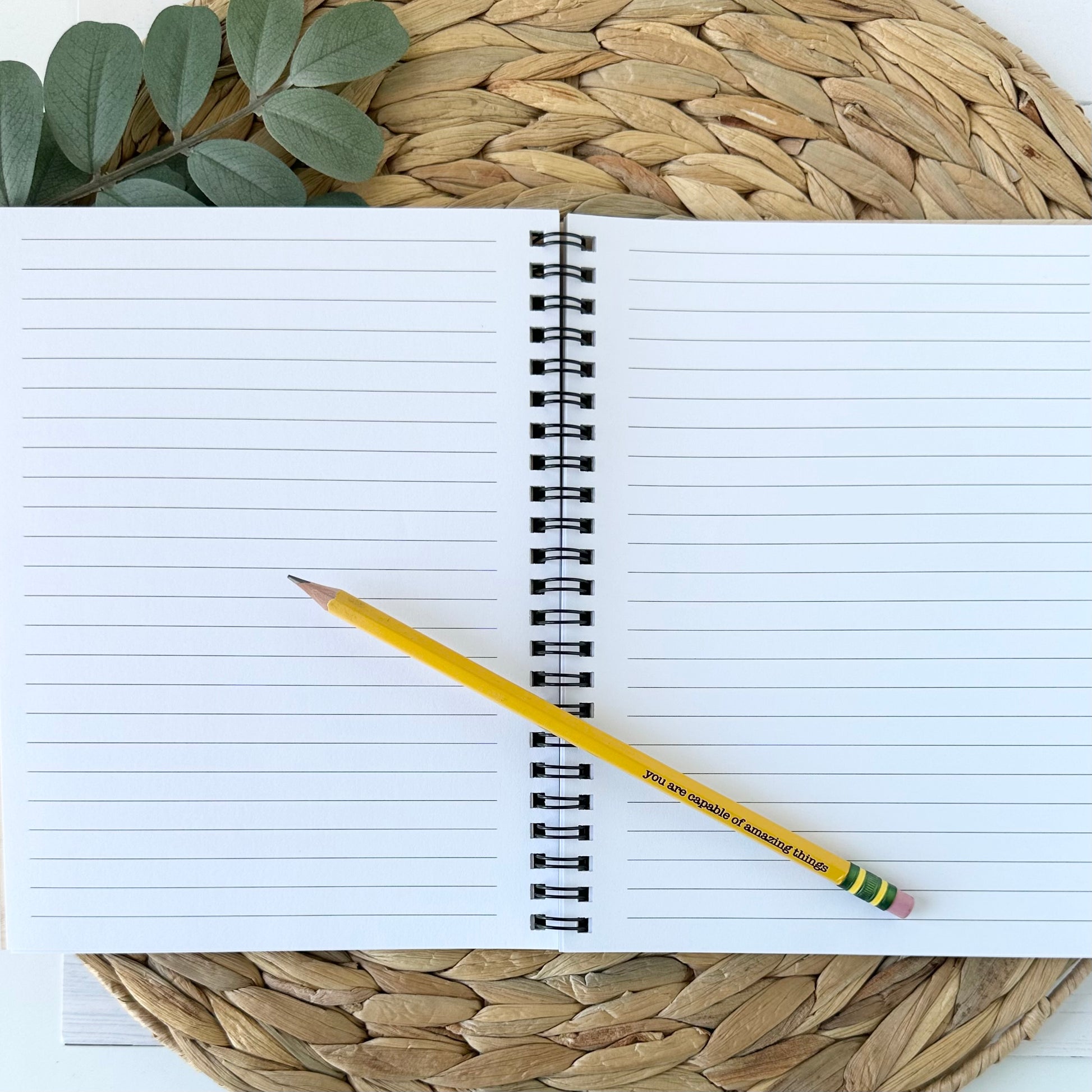 journal open with paper and pencil