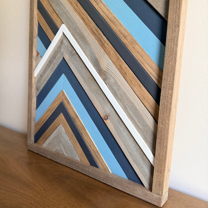 Geometric wood wall hanging made from reclaimed and natural wood